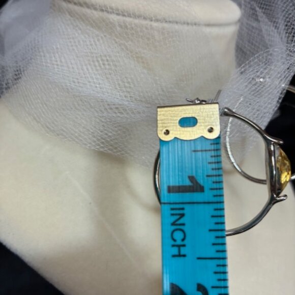 Silver tone hoop earrings with yellow rhinestones. - Picture 3 of 4